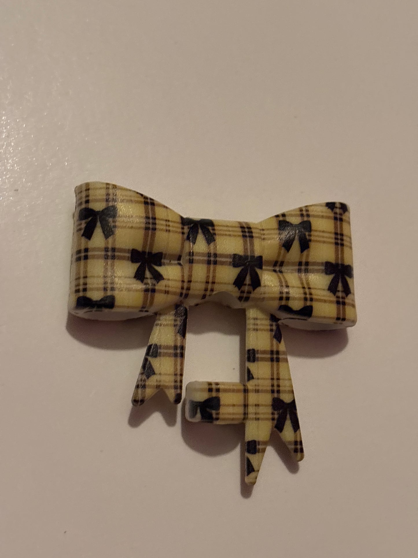 Yellow bow with black hearts silicone bow straw topper