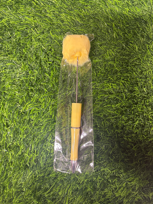 Yellow pompom pen
