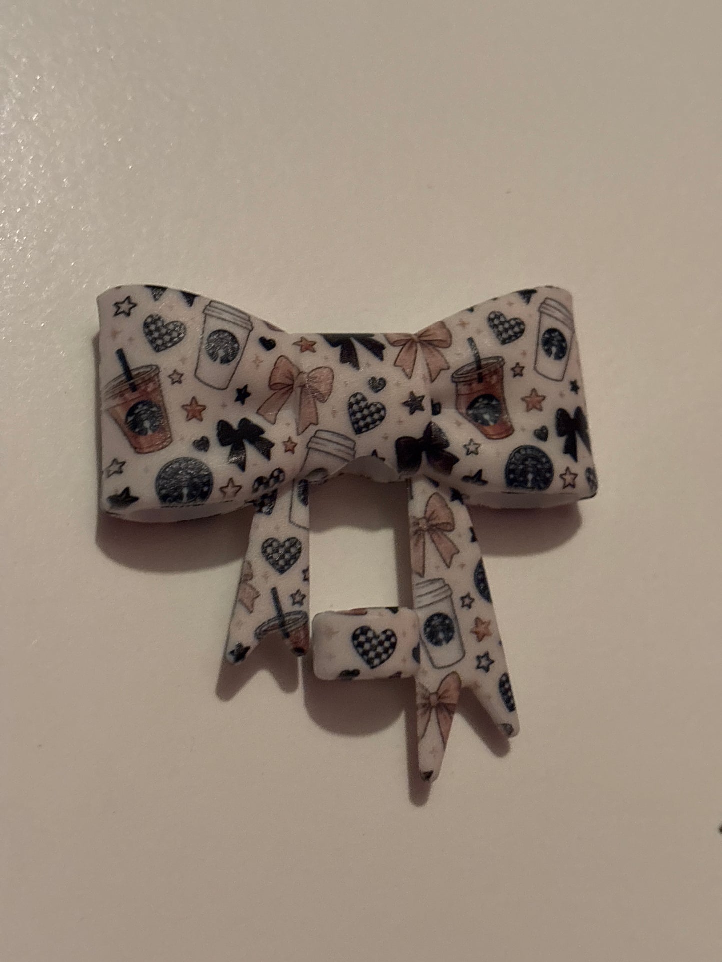 White Starbucks silicone bow straw topper