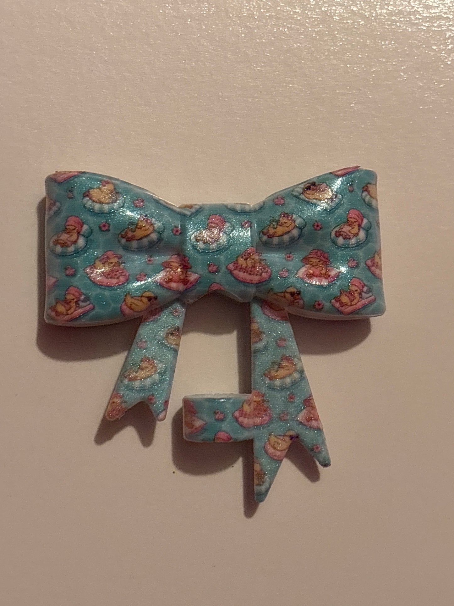 duck on a float silicone bow straw topper
